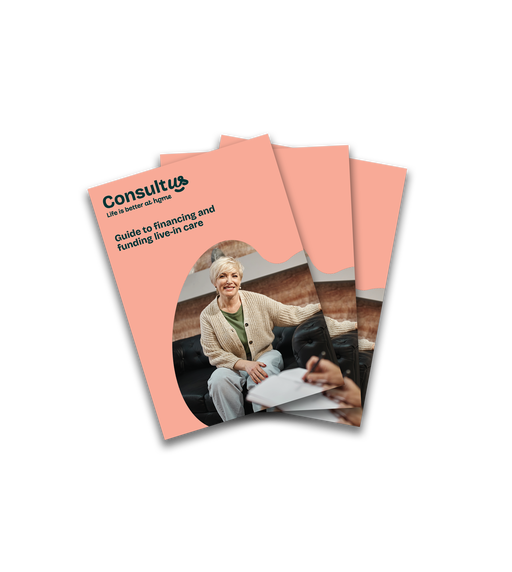 A live-in carere sitting with aapatient discussing some paperwork