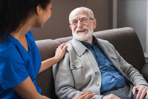 A lady talking to a live-in nurse.