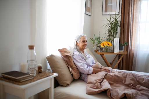 An elderly lady relaxing in bed